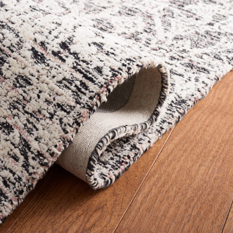 Caniah Hand Tufted Wool/Viscose/Cotton Floral Rug in Black/Ivory, Rectangle 5' x 8'