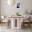 Table de salle à manger en pierre frittée simple de style crème avec supports de pieds rétro évidés-134007433