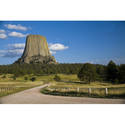 Dirt Road Leading To Devils Tower by Karelnoppe - Wrapped Canvas Print