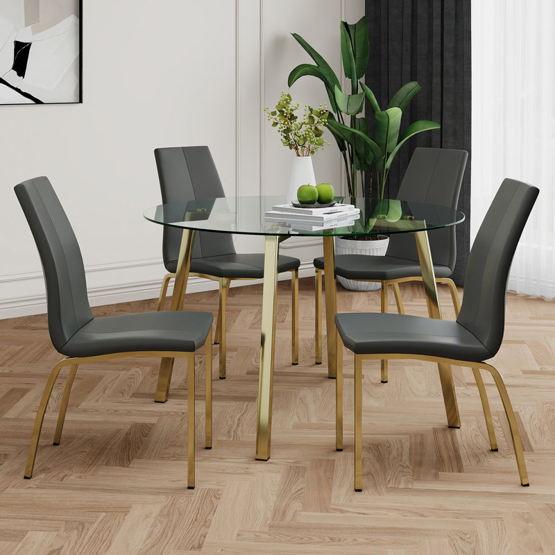 Table de cercle moderne en verre de style moderne, design transparent élégant, ensemble de chaises de salle à manger en polyuréthane à base de support durable, pieds de chaise plaqués or, convient aux cuisines de restaurant (ensemble de 5)