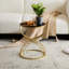 Table d'appoint élégante avec ornement en miroir noir et structure de base d'apparence moderne en métal doré pour tous les usages