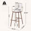 Tabouret de bar industriel moderne avec structure en métal et accoudoirs courbés