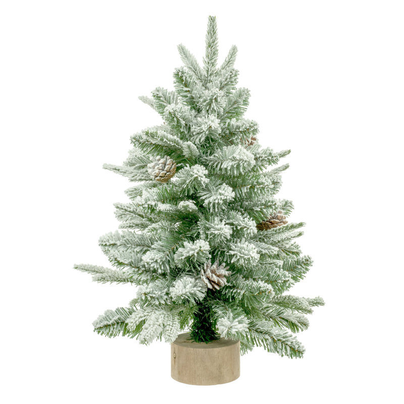Faux arbre vert foncé recouvert de neige