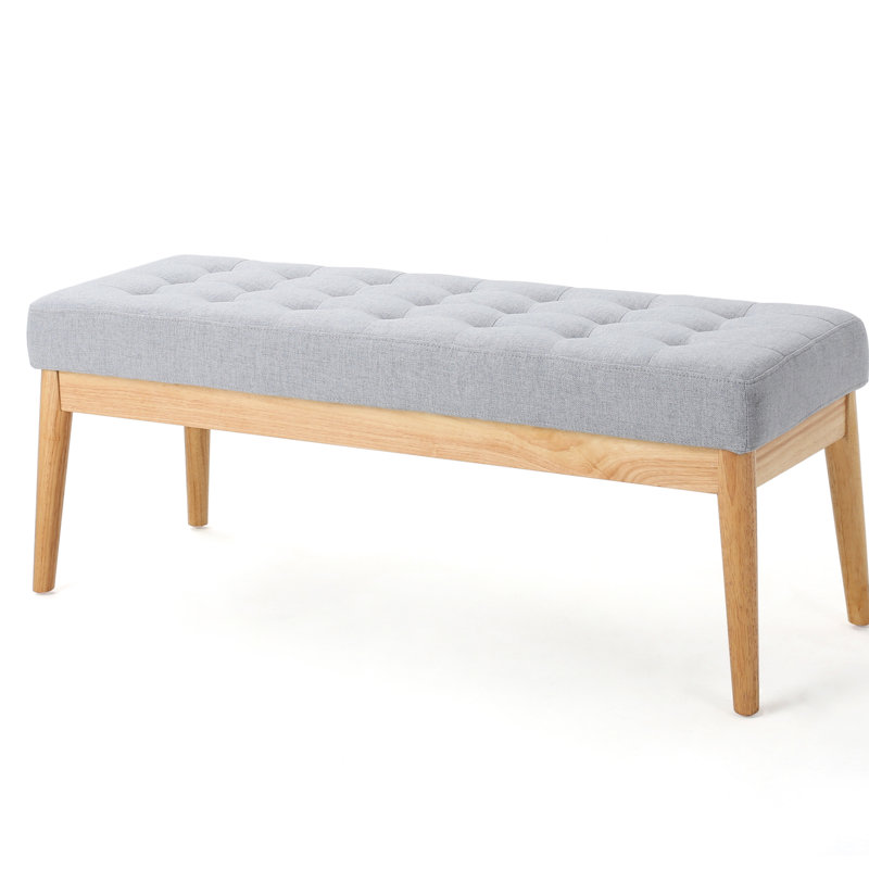 Moderne en gris avec coussin et pieds de banc en bouleau massif pour un salon confortable