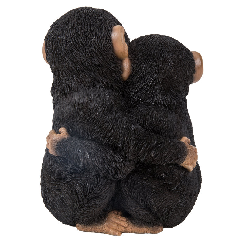 Chimpanzees Hugging Statue