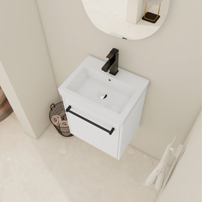 Meuble-lavabo mural moderne blanc de conception compacte avec lavabo en céramique et porte à fermeture en douceur pour petite baignoire