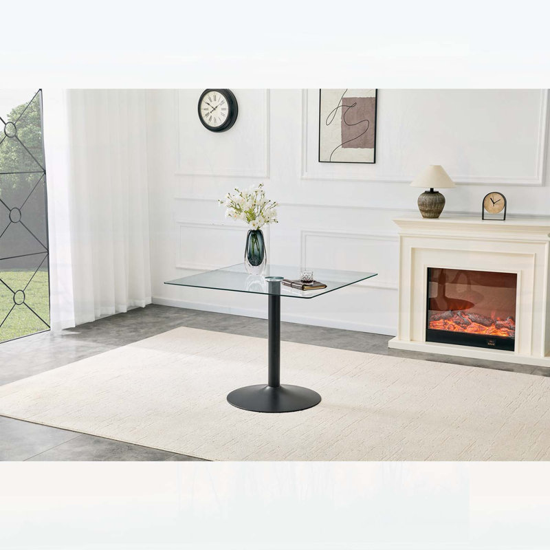 Table de salle à manger minimaliste avec base en métal à colonne unique, idéale pour les espaces compacts et une utilisation polyvalente.