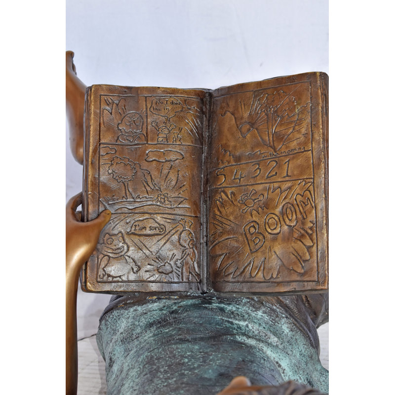 Statue en bronze d'un enfant sur un oreiller Aviles lisant un livre - Taille: L 32 po x l 13 po x H 12 po.
