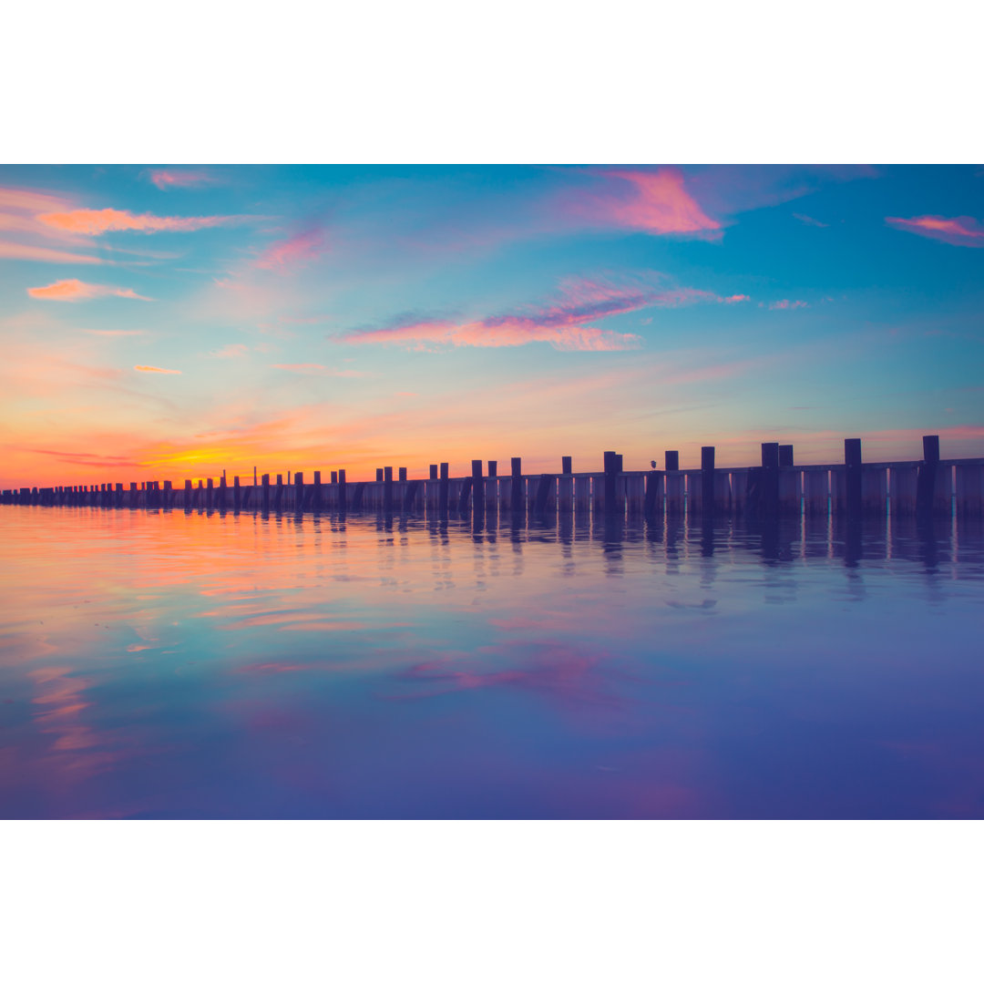 Pier At Sunset by Littleny - Wrapped Canvas Print