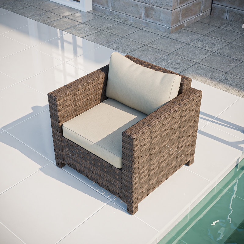 Chaise longue d'extérieur en osier avec coussins