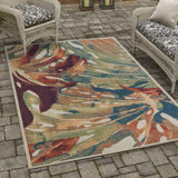 Tapis intérieur / extérieur vert / rouge à motif abstrait Tinesford