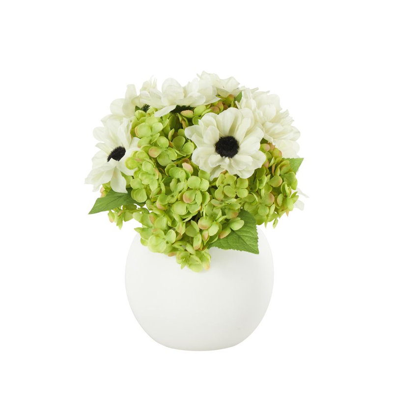 Cole et feuillage naturel en tissu gris avec feuilles vertes et vase rond en céramique