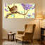 Oiseaux perchés sur une branche avec fleurs mauves, ensemble de 3 impressions sur toile-985858622