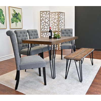 Les ensembles de table de salle à manger six pièces sont idéaux pour les réunions de famille, offrant diverses options de sièges et une conception peu encombrante pour les maisons modernes.