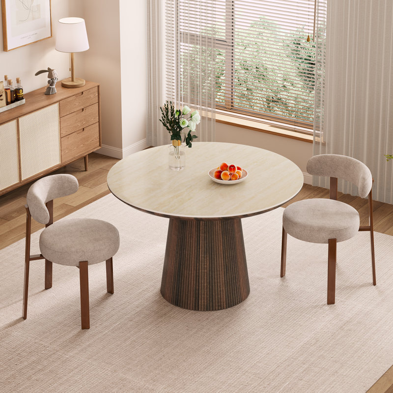Ensemble de table et de chaises Adwin pour 2 personnes, comprenant une table ronde en pierre frittée de 120 cm et 2 chaises rembourrées.
