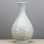 Carved Octagonal Porcelain Vase with Lotus and Fish Motif Celadon Glaze