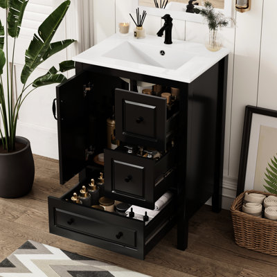 Meuble-lavabo autoportant noir de 24 po avec lavabo en céramique lisse, une porte à fermeture douce et 3 tiroirs de rangement pour salle de bain à un trou