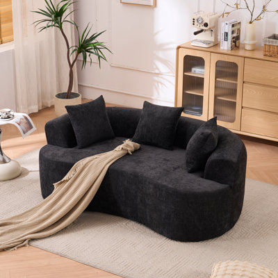 Crescent-shaped sofa, modern low-back design with deep cushions, self-inflating foam-filled large two-seater sofa requiring no assembly.