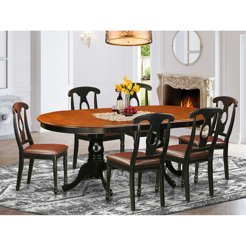 7 Piece Dining Table Set consists of an Oval Dinner Table with Butterfly Leaf and 6 Faux Leather Dining Room Chairs, Black & Cherry