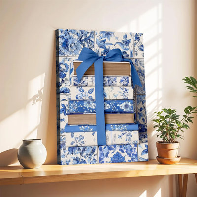 Tableau grand format sur toile tendue, motif floral bleu et blanc, livres empilés avec ruban bleu, idéal pour le salon ou la chambre. Parfait pour le salon ou la chambre.