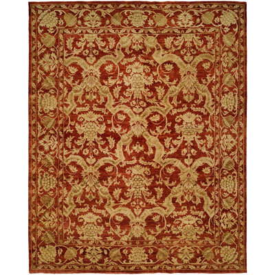 Tapis oriental rouge / doré en laine noué à la main