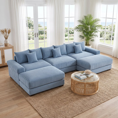 Canapé d'angle modulaire surdimensionné en velours côtelé, assise profonde avec larges accoudoirs rembourrés, bleu, 3 places, 2 poufs