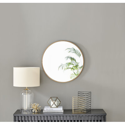 Alcantera Round Metal Frame Wall Mirror Simple and Elegant Modern Design