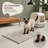 This ultra-absorbent 28 x 22 in soft chenille litter box mat uses long plush chenille for deep trapping, while a waterproof TPR anti-slip backing helps manage moisture; the mat absorbs moisture and is machine washable.