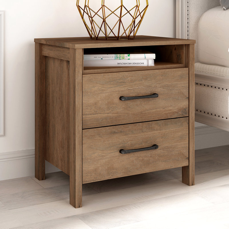 Wooden nightstand with a drawer and an open shelf, styled with a gold geometric bowl and stacked books.