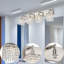Luminaires de salle de bain en cristal 4 lumières au fini noir pour luminaires de salle de bain au-dessus d'un miroir avec abat-jour en cristal.-85058512
