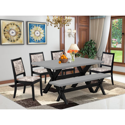 L'ensemble de salle à manger 6 pièces se compose d'une table et d'un banc avec plateau de table et de 4 chaises empilables en tissu de polyester à motif blanc et gris - noir brossé