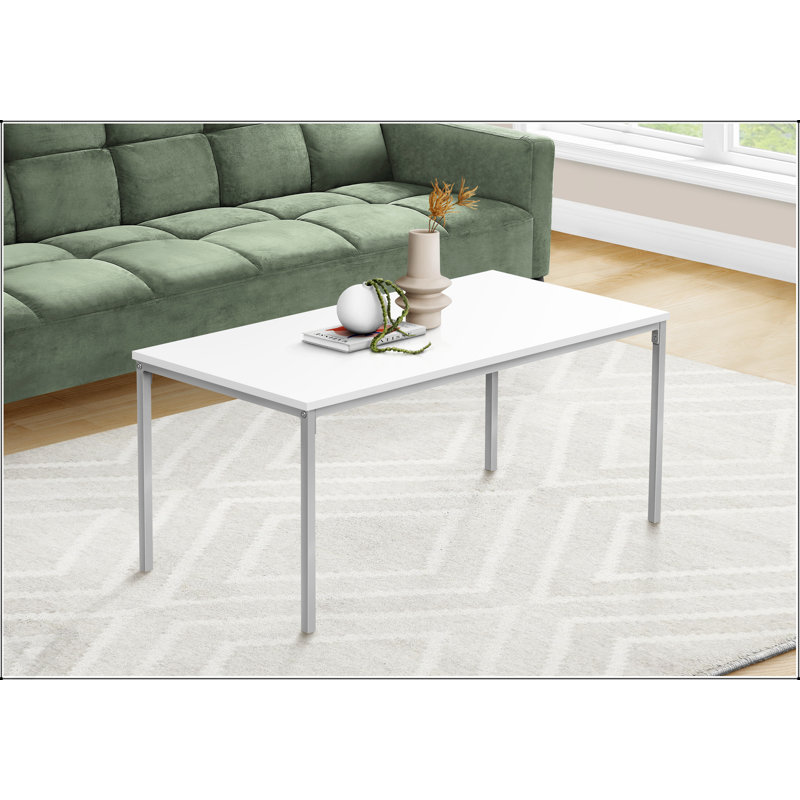 Table basse moderne et moderne, plateau en stratifié blanc élégant avec pieds robustes en métal gris pour des salons élégants.