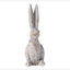 Statue de lapin en ciment patiné