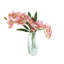 Arrangement d'orchidées dans un vase miroir-884489741