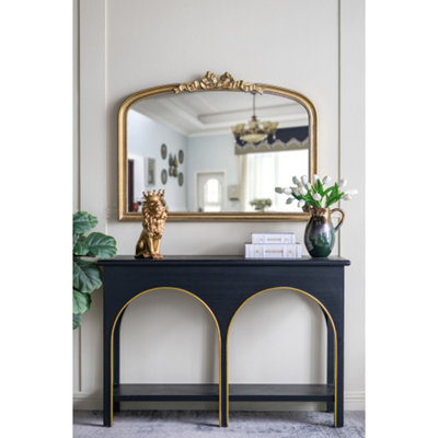 Miroir mural arqué avec cadre doré orné