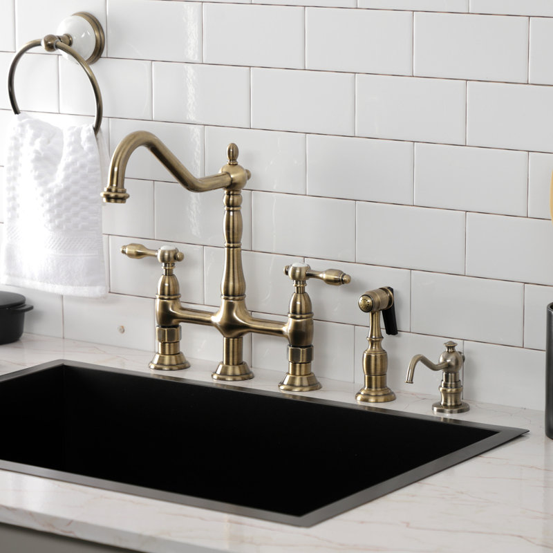 Kingston Brass Tudor Two-Handle 4-Hole Deck Mount Bridge Kitchen Faucet with Brass Side Sprayer, Antique Brass