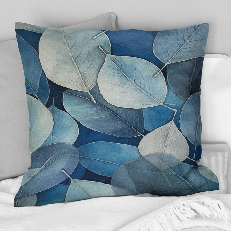 Coussin décoratif à imprimé floral gris et bleu avec feuilles