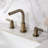 Kingston Brass NuvoFusion Two-Handle 3-Hole Deck Mount Widespread Bathroom Faucet with Brass Pop-Up Drain-128514171