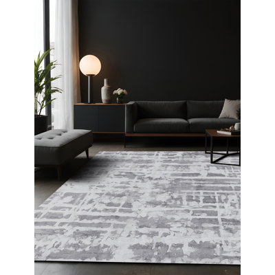 Tapis gris soyeux et moelleux