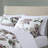 Modern Bedroom With Mauve Floral Comforter And Sheets Coordinating-116011319