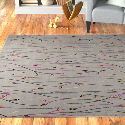 Tapis gris à motif floral Aratrika