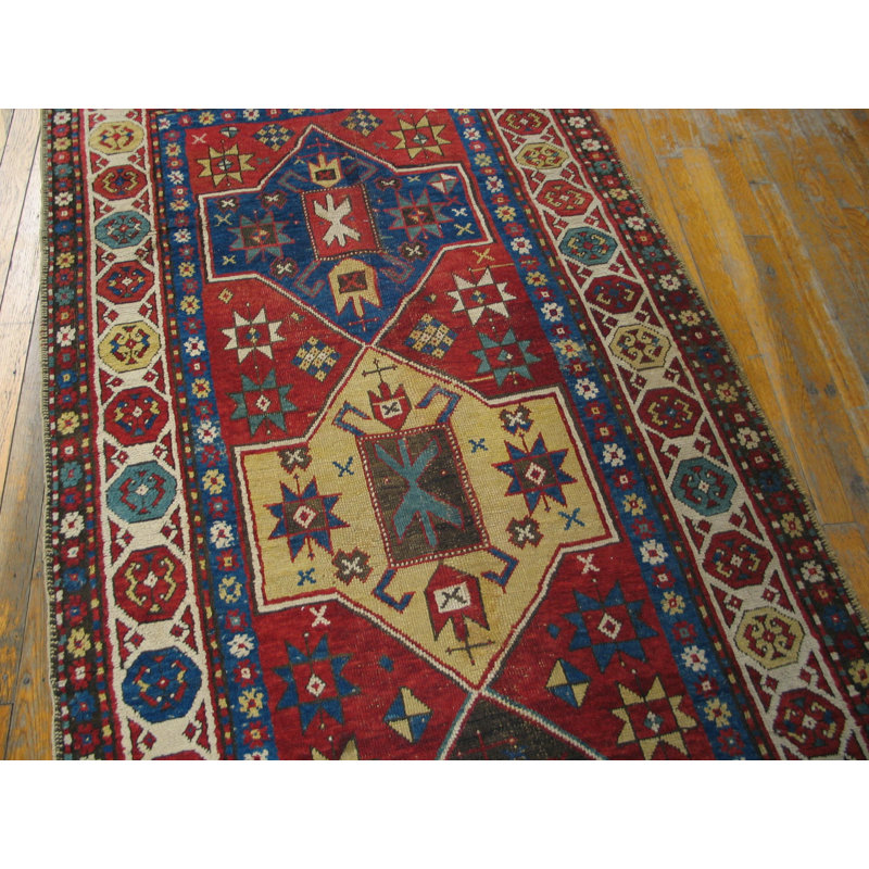 Tapis antique à motif géométrique de style tribal
