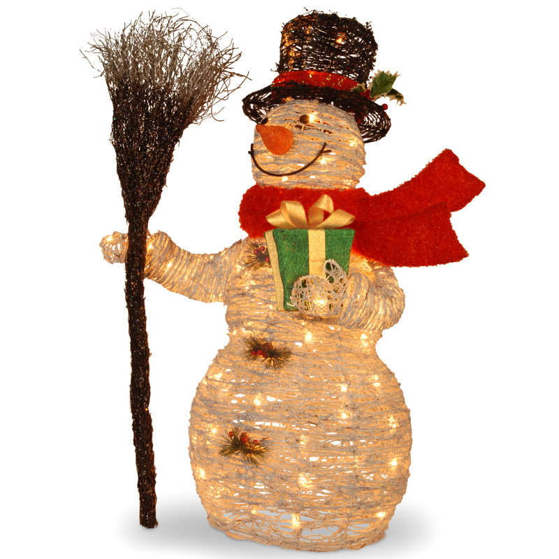 En rotin bonhomme de neige comportant un présentoir à cadeau et à balai