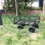 Charrette utilitaire à quatre roues Charrette de jardin en acier avec pneus en caoutchouc Transport robuste avec côtés pliables détachables Capacité de 550 lb. Noir-121615354