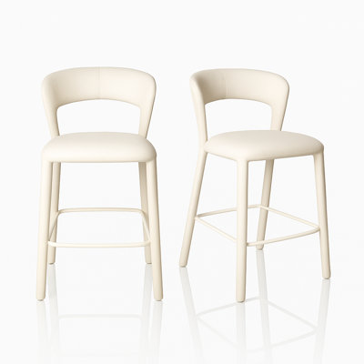 Ensemble de 2 tabourets de comptoir en similicuir à dossier ouvert, silhouette arquée et repose-pieds, blanc crème