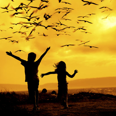 Two Children Chasing Seagulls by Imagedepotpro