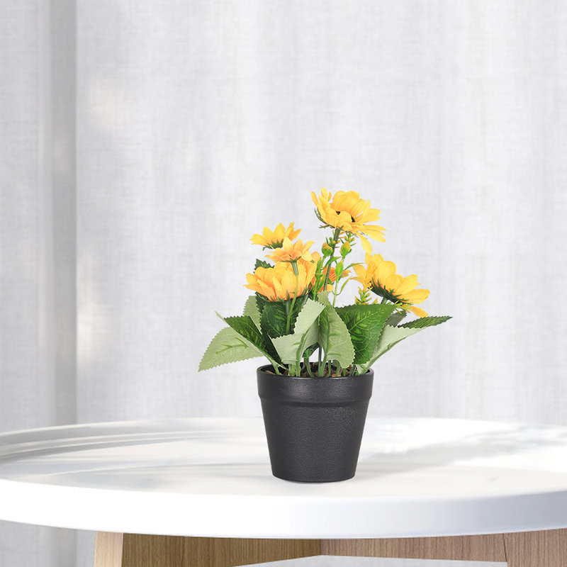 Plante artificielle en pot à fleurs jaunes