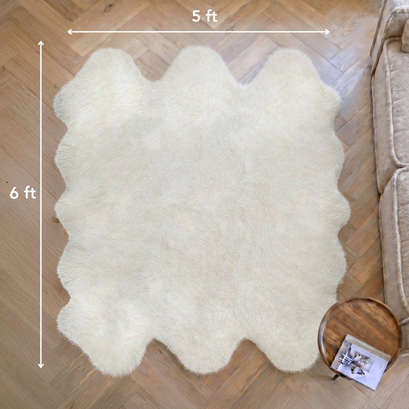 Novelty Colello Solid Color Handmade Sheepskin 5' x 6' Area Rug in Natural