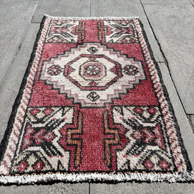 Vintage Turkish Rug in Vibrant Red Ideal for Wall Hanging or as an Antique Door Mat