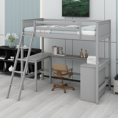 Lit mezzanine peu encombrant avec bureau et tablettes intégrés